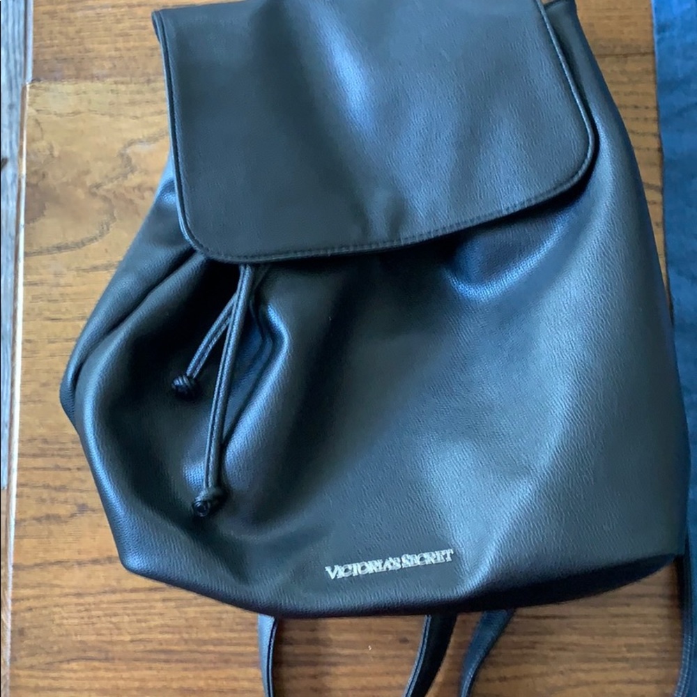 Black drawstring backpack style bag
